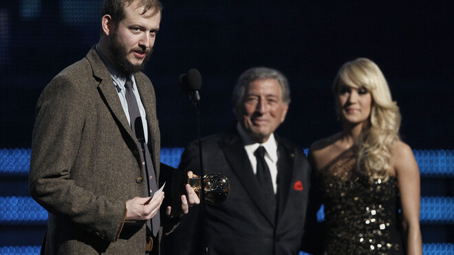 Eau Claire's Justin Vernon accepts Bon Iver's BEst New Artist Grammy as unnamed presentes look on. Photo: AP
