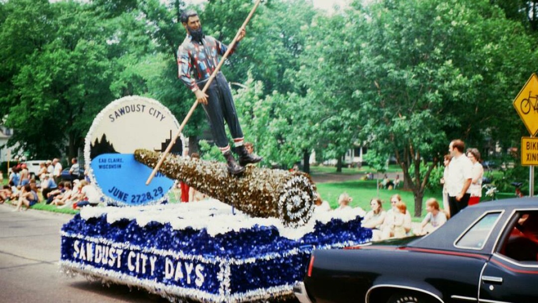 You see kids, in the olden days, lumberjacks used to ride giant Swiss Cake Rolls right down the Mighty Chip' to the Cake Roll Mill. Just kidding. Man, you don't see that kind of parade float craftsmanship around here any more. (Photo from Bob Gruen.