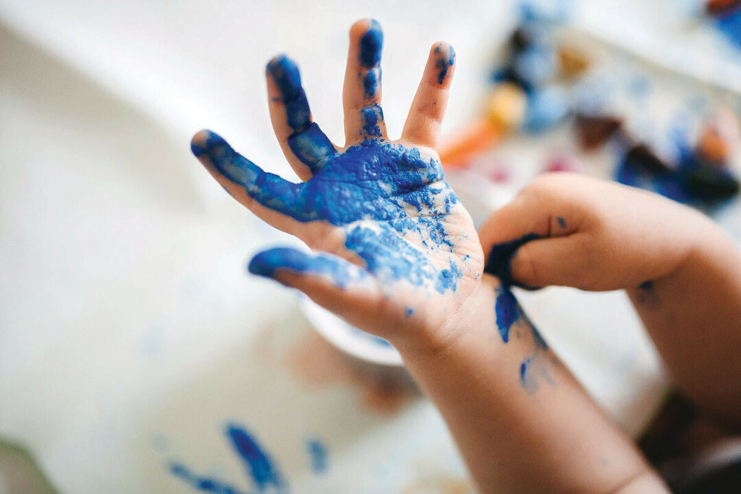 Fingerpainting is a good way for young children to begin exploring art.